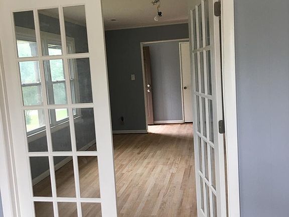 French doors separate the den and living room.