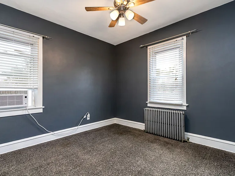 Bedroom 2 on 1st floor located just past full bath and adjacent to stairs to 2nd floor