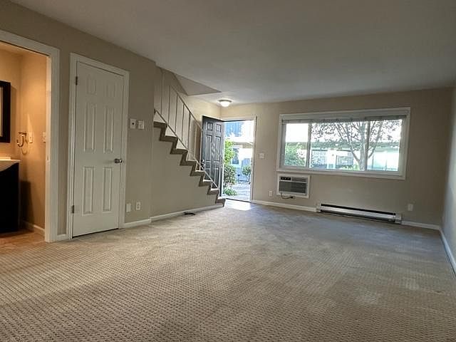Large living room with 1/2 bath_.no need for guests to share your private bath facilities upstairs. New Carpet!
