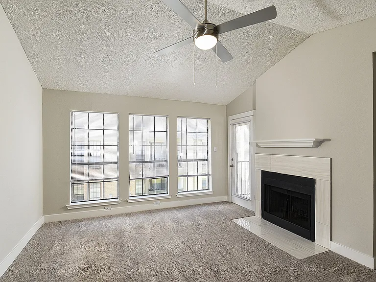 One Bedroom A3 - Living Area with Vaulted Ceiling and Fireplace