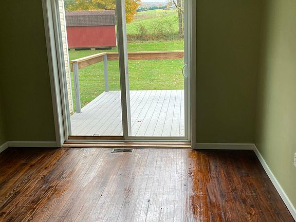 Living room with slider to outdoor deck