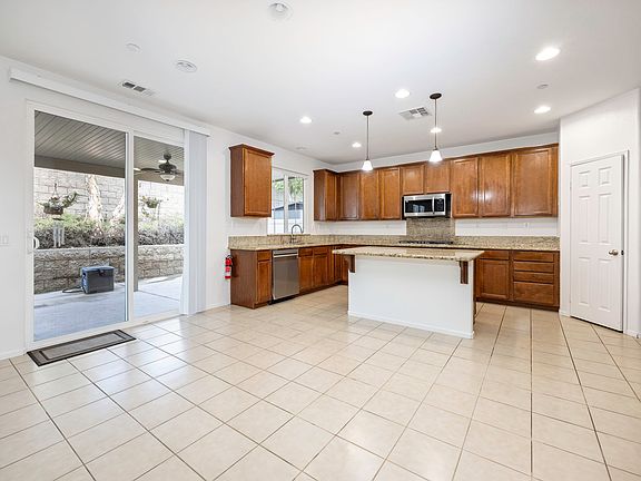 Open floor Plan, Counter Depth Double Door Oven, Over Range Microwave Exhaust, Dishwasher, Sliding Patio Doors