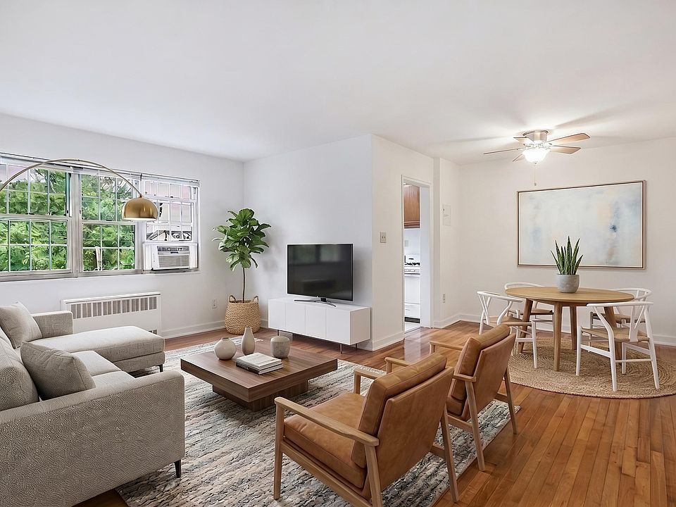 Living room, dining area and kitchen (virtually staged) at Mason Hall in Alexandria, VA 22314