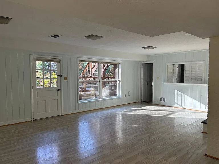 Family Room with garden access and access to laundry room with new appliances