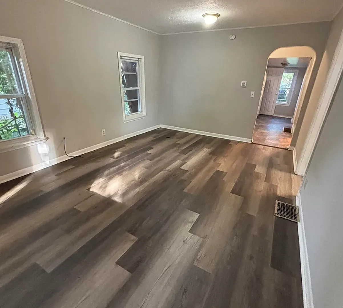 Charming 2-Bedroom Home | Fenced Backyard | Prime Lansing Location — Photo 3