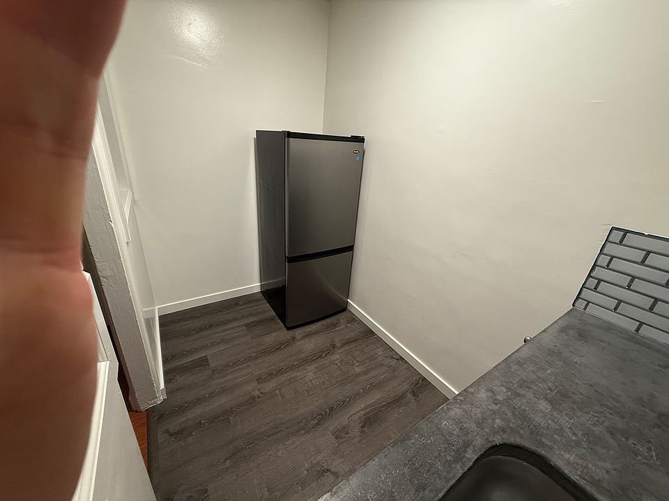 Unit 304 Kitchenette Fridge Side (plus photographer's hand)
