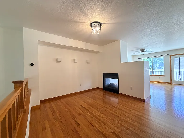 Double sided gas fireplace in second living room / dining area