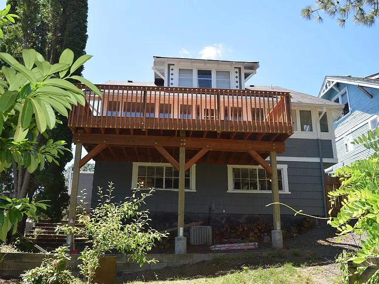 Nice fenced back yard, with a garden area and chicken coop!