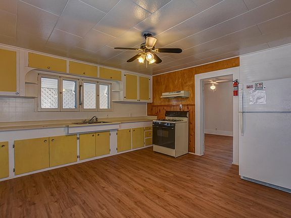 kitchen area looking to back bedroom