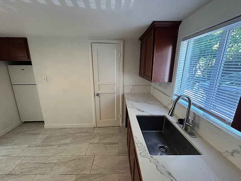Kitchen to Bathroom Door.