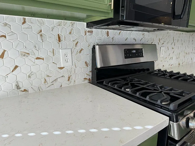 Gorgeous new back splash and SS range, microwave oven