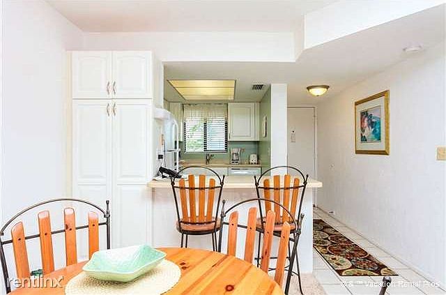 A dining table and a breakfast bar
