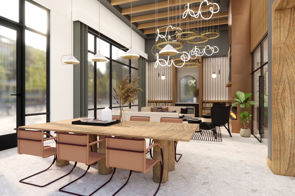 Resident lounge with gathering space, fireplace, and comfortable seating.
