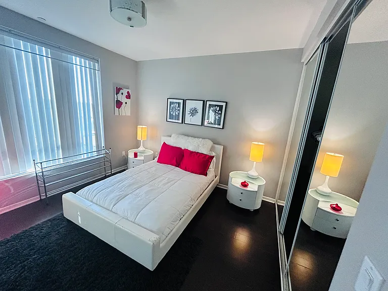 Room has hardwood floors with area rug