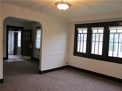Dining room view showing Arts and Crafts style woodwork.