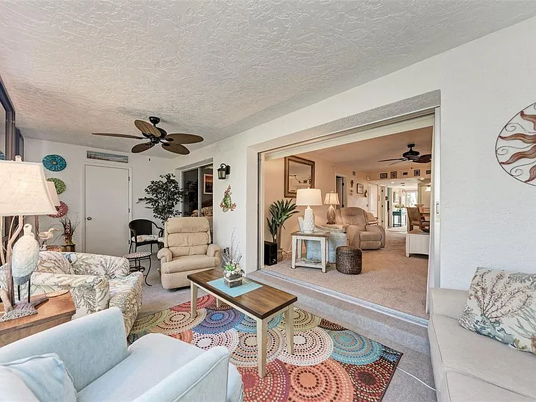 Open up the sliders and enjoy the fresh Englewood air from the comfort of Unit 1003's screened-in lanai.