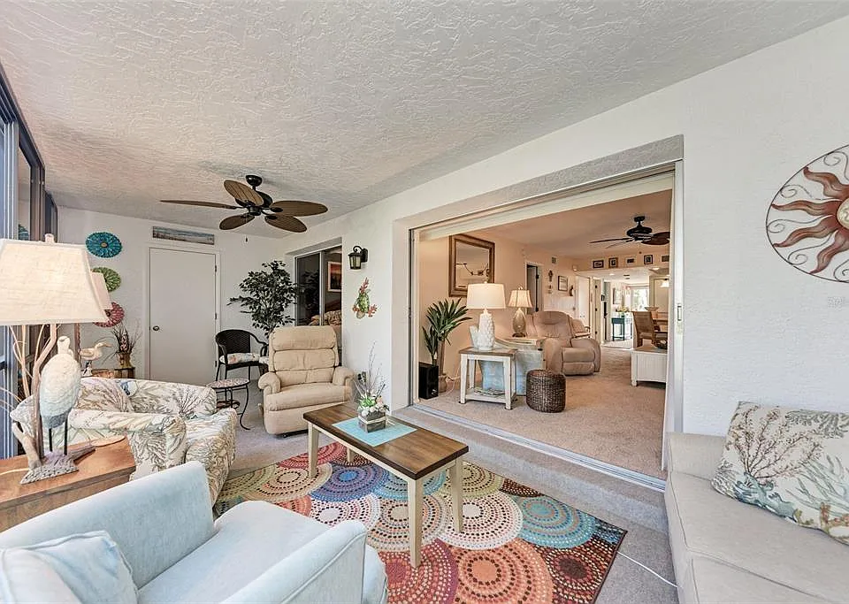 Open up the sliders and enjoy the fresh Englewood air from the comfort of Unit 1003's screened-in lanai.
