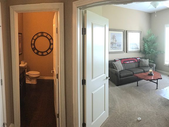 Den, 1/2 bath off entry