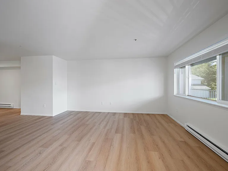 Experience the elegance of contemporary design in this bright, open living area.