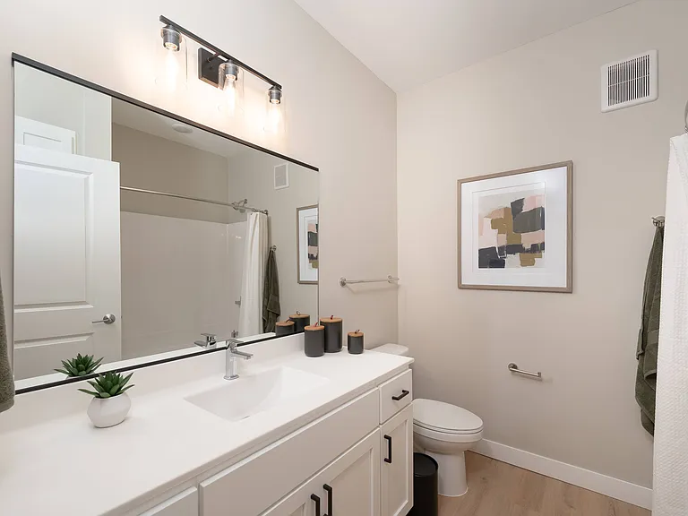 A clean vanity setup with functional storage and everyday convenience.
