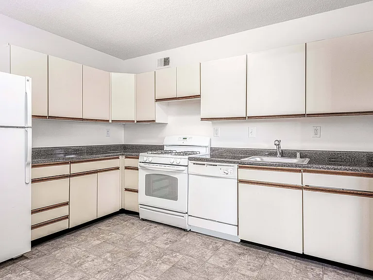 Update kitchen counters with ample storage space and gas range