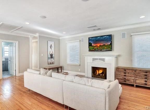 Cozy up by the fireplace in the spacious living room