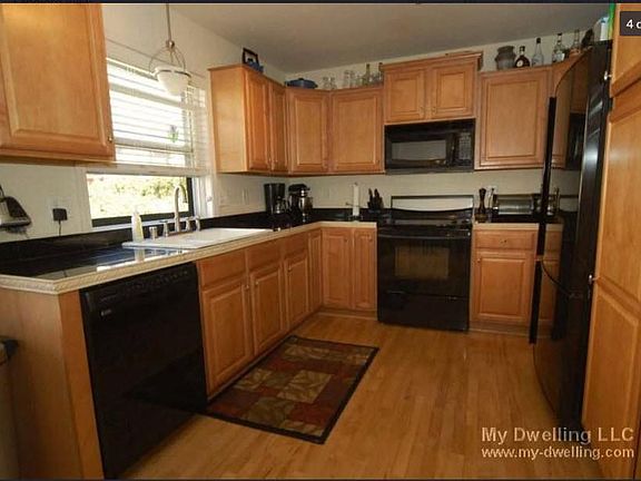 Kitchen new aluminum microwave installed.