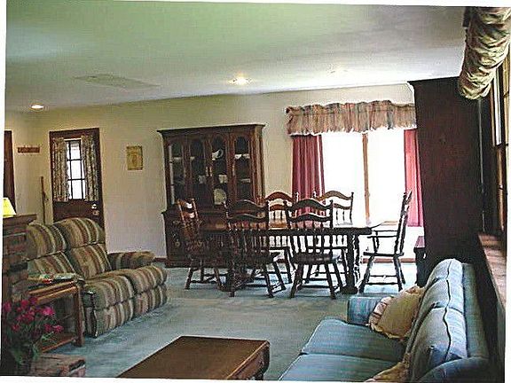 open plan with wood-burning fireplace