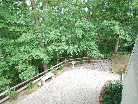 Brick Patio overlooking private woods to golf course