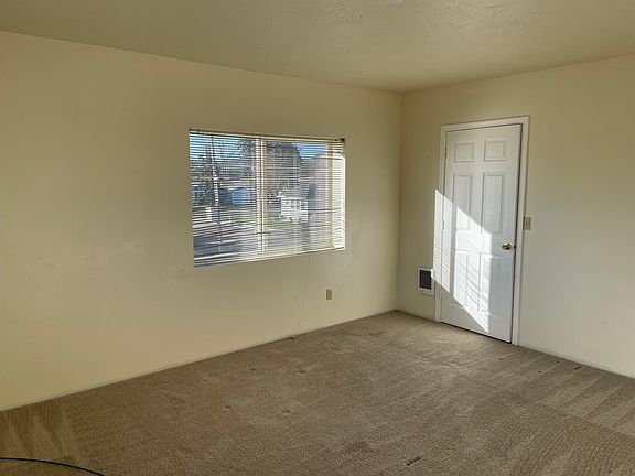 Bedroom (carpeted) with closet door.