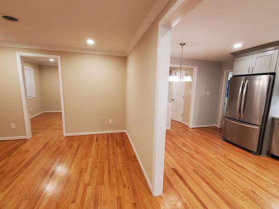 View from Hall. Living Room, Kitchen, Den.