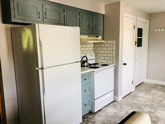 Kitchen, entry door, and storage closet