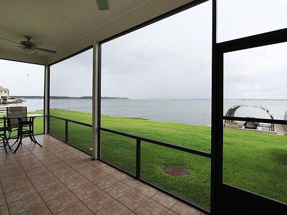Enjoy the screened patio.  Notice you are right on the waterfront.