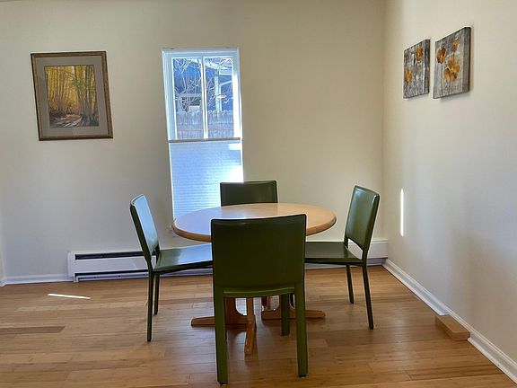 Maple table with comfortable leather chairs. Has a leaf to make table larger.