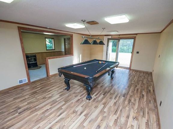 A very nice den area (14X27), with a pellet stove (2010). Currently being used as a billiards room, could also be used as a family room, or a play room for the kids!
