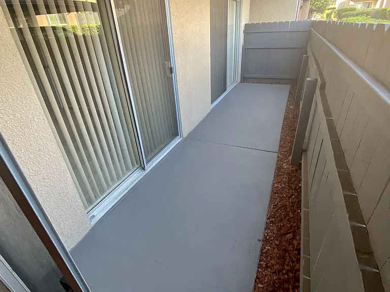 Private porch with access from master bedroom and living room at Villa Pacific Apartments in Oceanside, California.