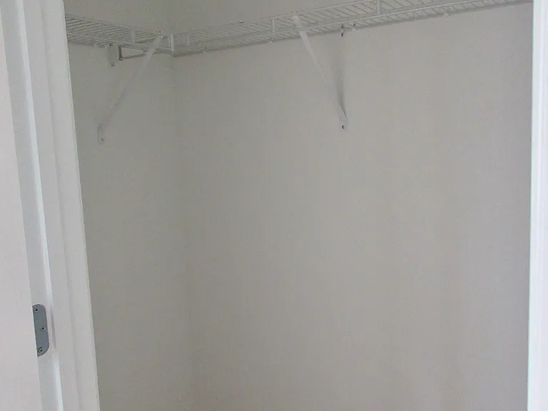 Sm walk-in closet primary bedroom
