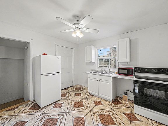 Kitchen looking at entry to br2 and back yard
