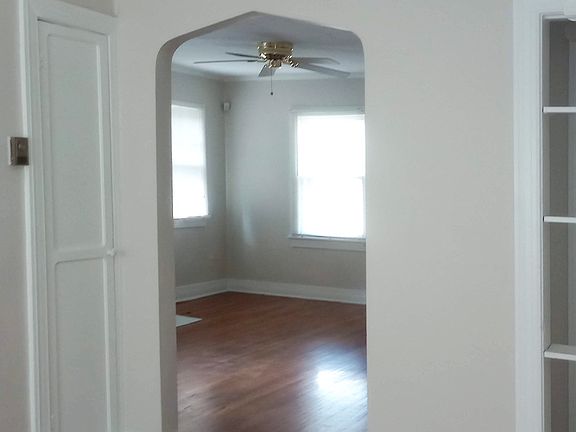 View of living room through decorative archway.
