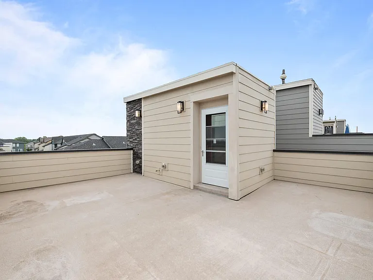 Spacious roof top patio with gas line for a grill or fire pit