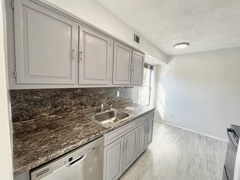 Another view of the eat-in kitchen area that can fit a table or be used for extra storage