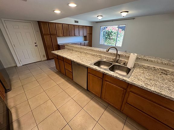 Spacious kitchen with generous amount of cabinet space.