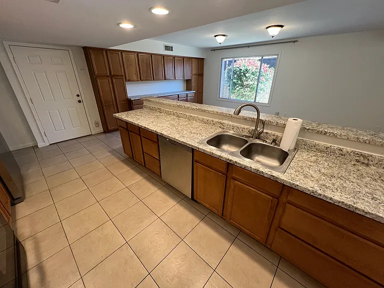 Spacious kitchen with generous amount of cabinet space.
