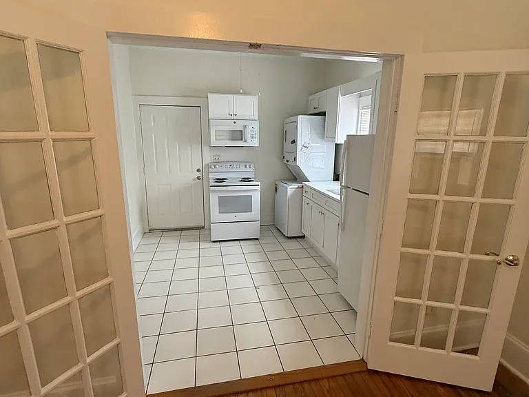 Kitchen view from the living room through open French door.