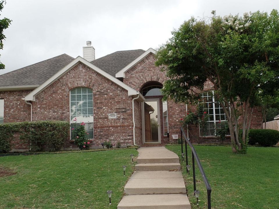 Front view with storm door