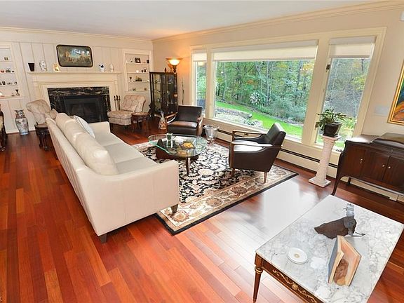 Majestic Formal LivingRoom 27'x15'. Newer Hardwood Flooring. Architectural Fireplace. Oversized Picture  Window! Lots of Natural