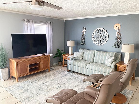 Large smart tv with comfortable furniture to view. Internet provided