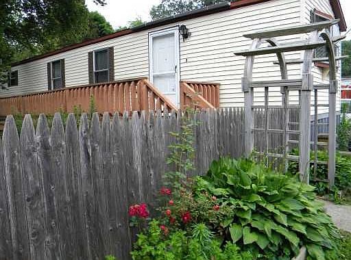 Side deck and fenced in yard.