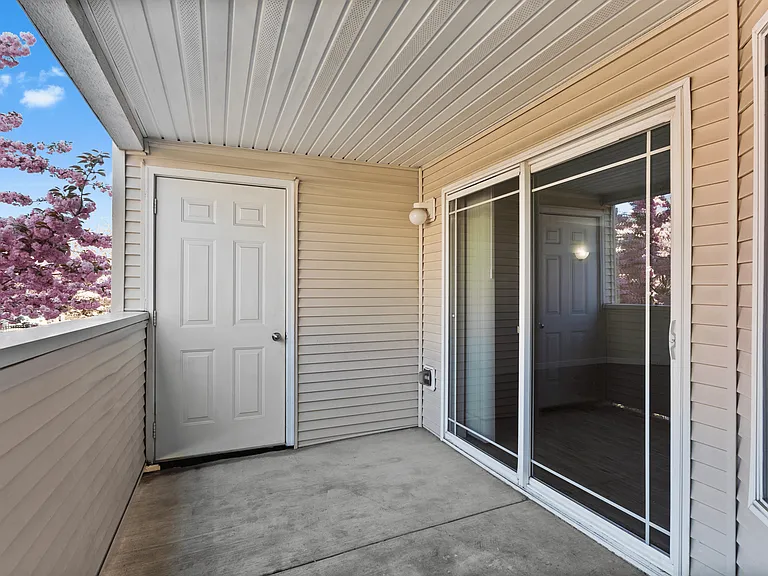 Private covered balcony with extra storage space.