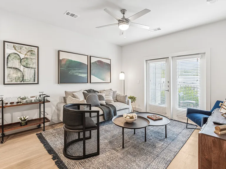 Your Living Room: Hardwood floors and balcony access